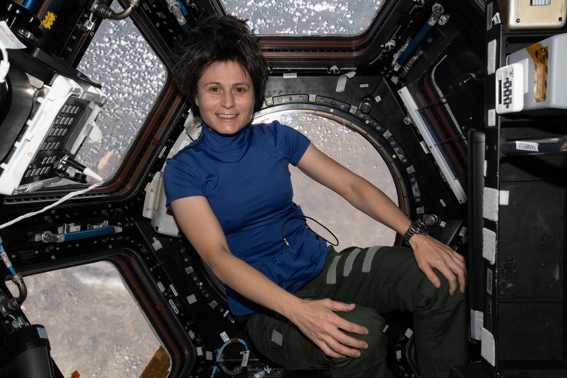 image of astronaut with smart shirt on floating in the cupola 