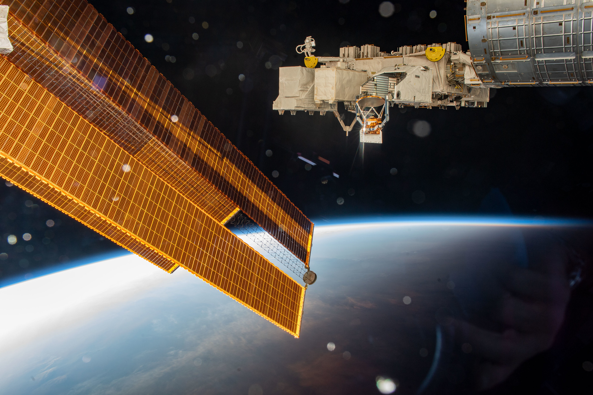image of solar arrays and exterior platform of the space station