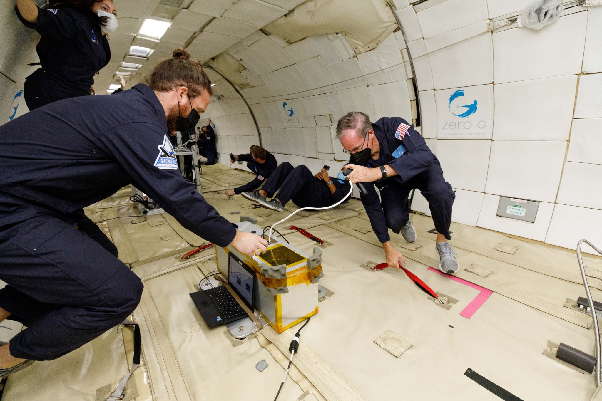 Tests being conducted on a zero gravity flight.