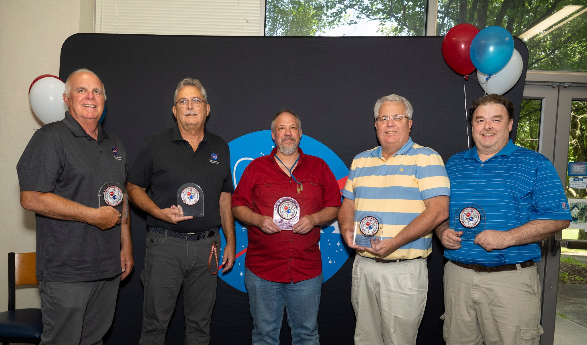 Team members recognized with awards for their 20-year contributions to the Microgravity Science Glovebox.