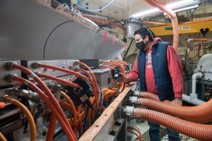 A NASA employee inspecting an engine.
