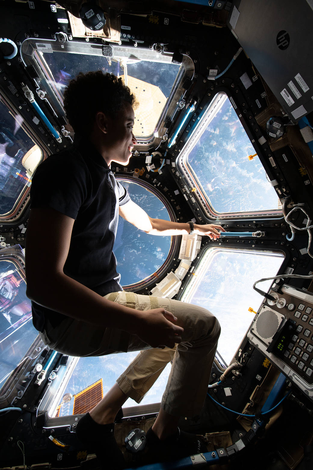 NASA astronaut and Expedition 67 Flight Engineer Jessica Watkins enjoys the view of Earth on May 5, 2022, from inside the International Space Station's seven-windowed cupola. 