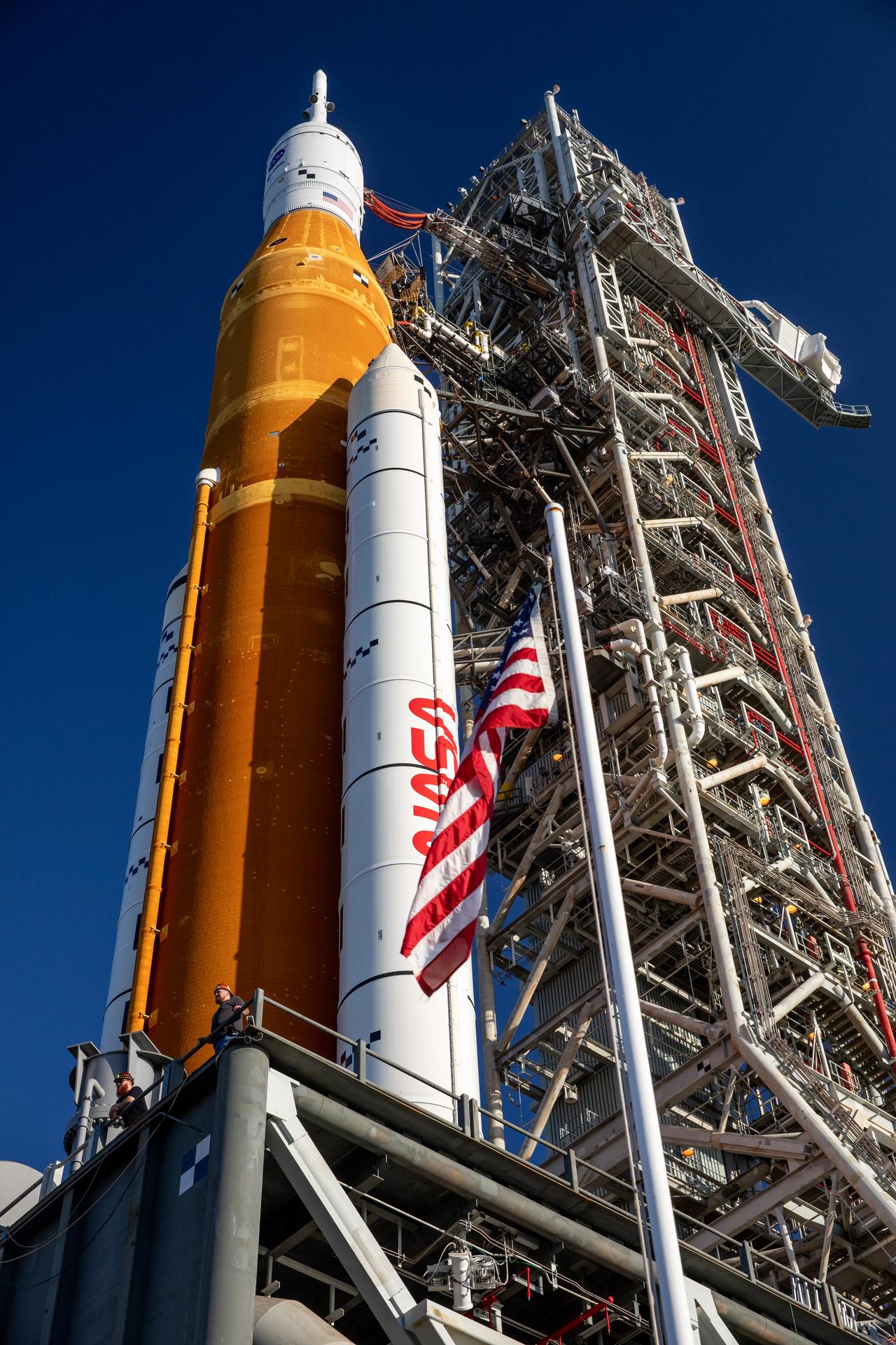 NASA’s Space Launch System (SLS) rocket and mobile launcher, carried atop the crawler-transporter 2, are seen at Launch Pad 39B at the agency’s Kennedy Space Center in Florida.