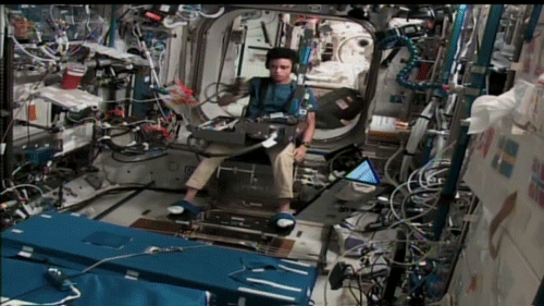 moving image of an astronaut participating in an experiment