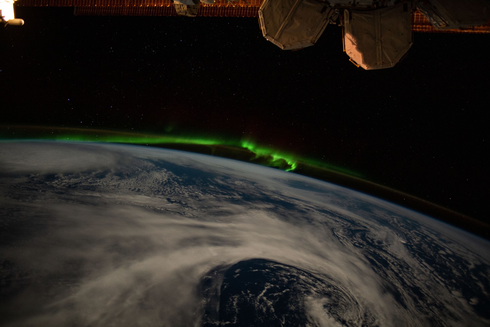 image of the auroras dancing over Earth's atmosphere