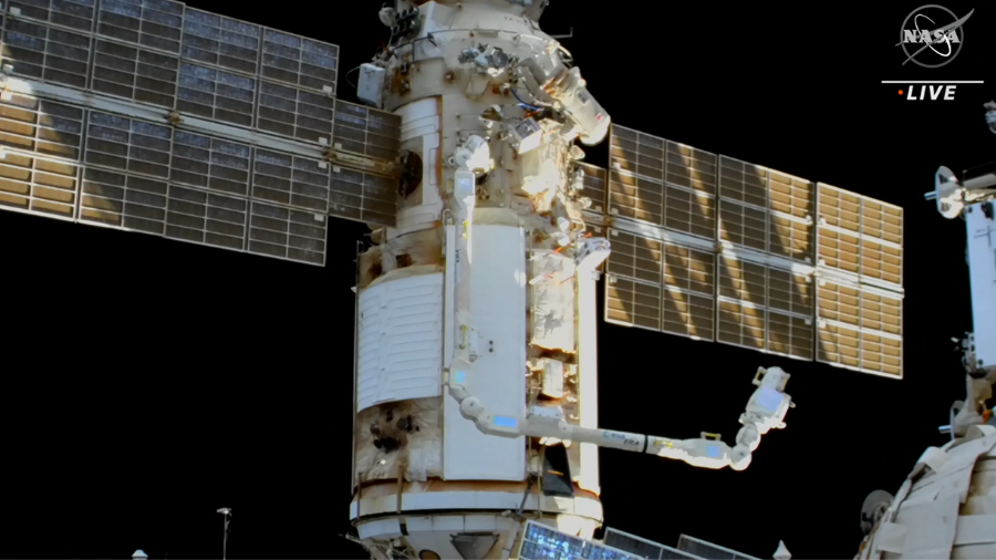 Flight Engineer Denis Matveev makes his way back inside the station after being instructed by Russian flight controllers to end the Aug. 17 spacewalk at the International Space Station due to a battery power issue on Artemyevâs Orlan spacesuit.