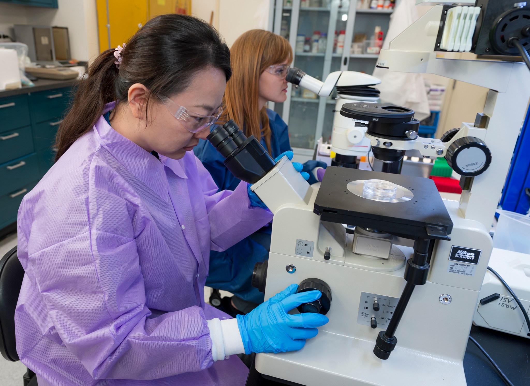 GeneLab Sample Processing Lab N-239 rm 128 with Yi-Chin Chen in foreground and Valery Boyko at the microscope.