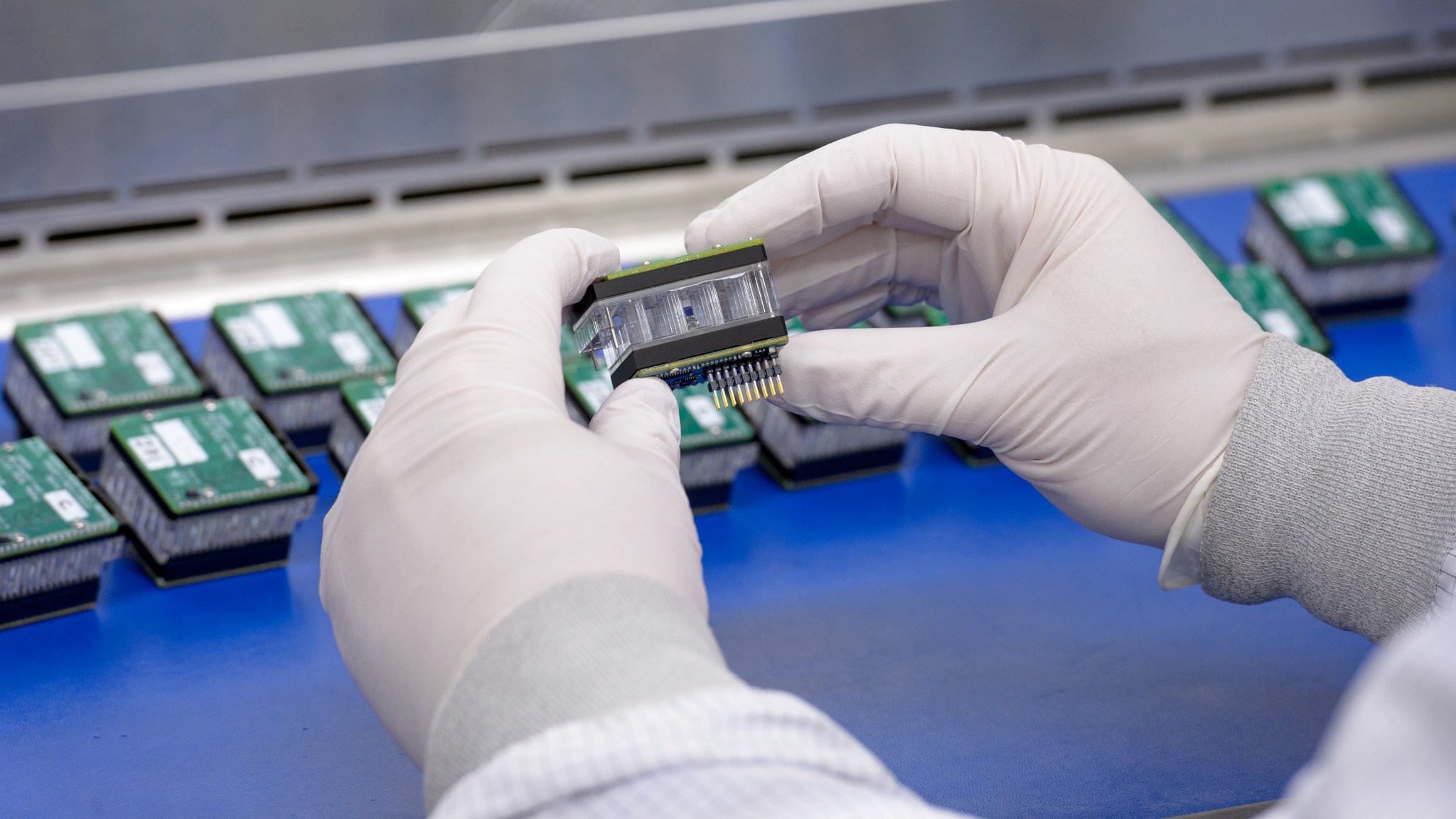 A BioSentinel payload engineer works on assembling a BioSensor payload.