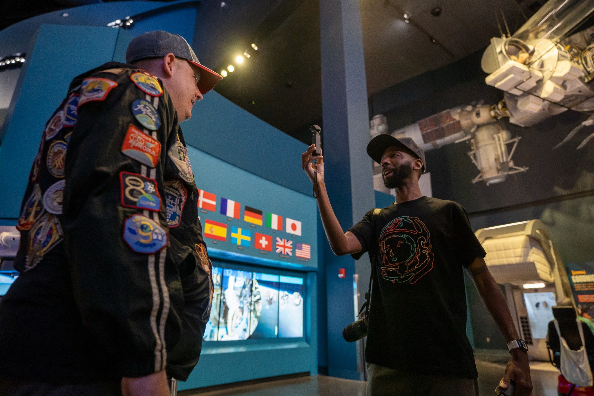 Guests visit the Space Launch System exhibit at the Kennedy Space Center Visitor Complex in Cape Canaveral, Florida. 