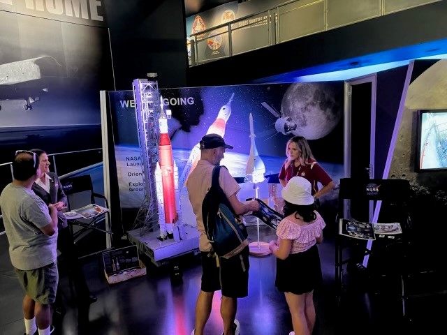 Guests visit the Space Launch System exhibit at the Kennedy Space Center Visitor Complex in Cape Canaveral, Florida. 