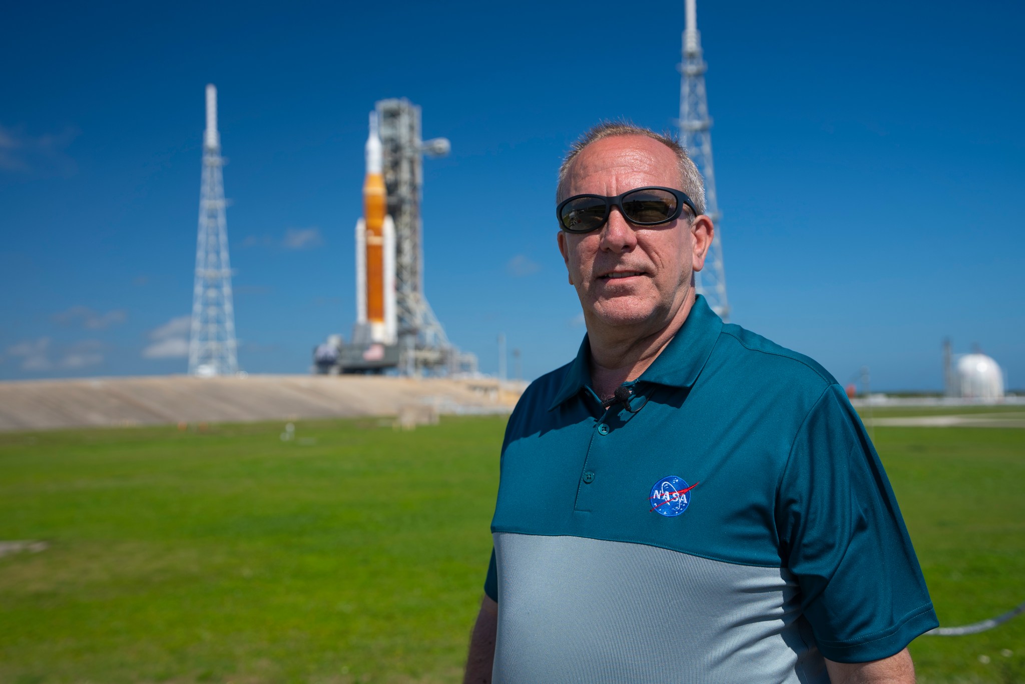 In March 2022, David Beaman, manager of the Space Launch System (SLS) Engineering & Integration Office at NASA’s Marshall Space Flight Center in Huntsville, Alabama, views the SLS rocket on the launch pad when it rolled out the first time.