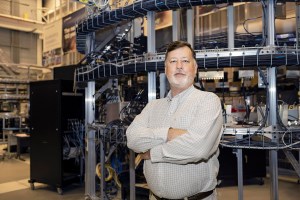 Eric Corder, manager of the Space Launch System Exploration Upper Stage Avionics and Flight Control Subsystem, in front of the booster avionics qualification line at Marshall.