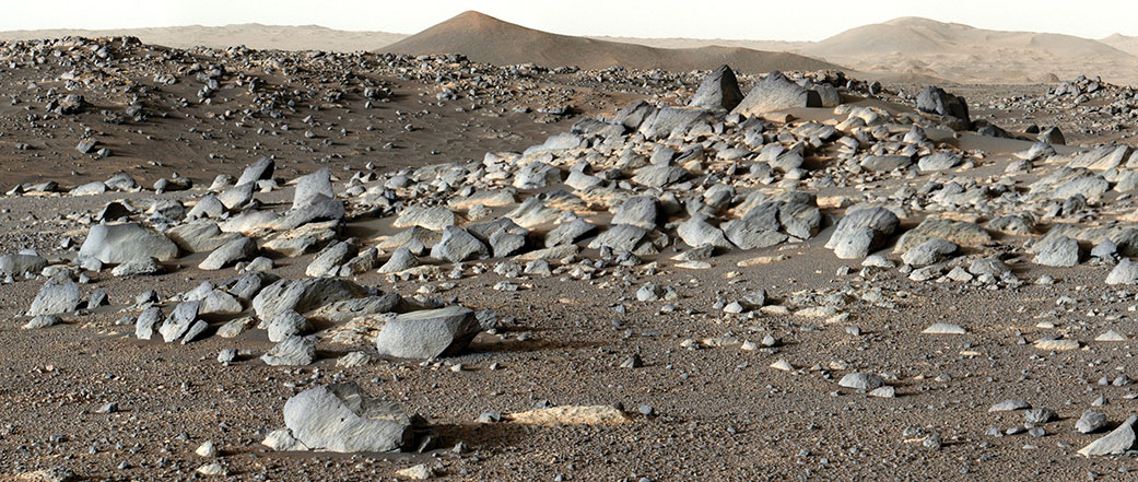 NASA’s Perseverance Mars rover looks out at an expanse of boulders on the floor of Jezero Crater