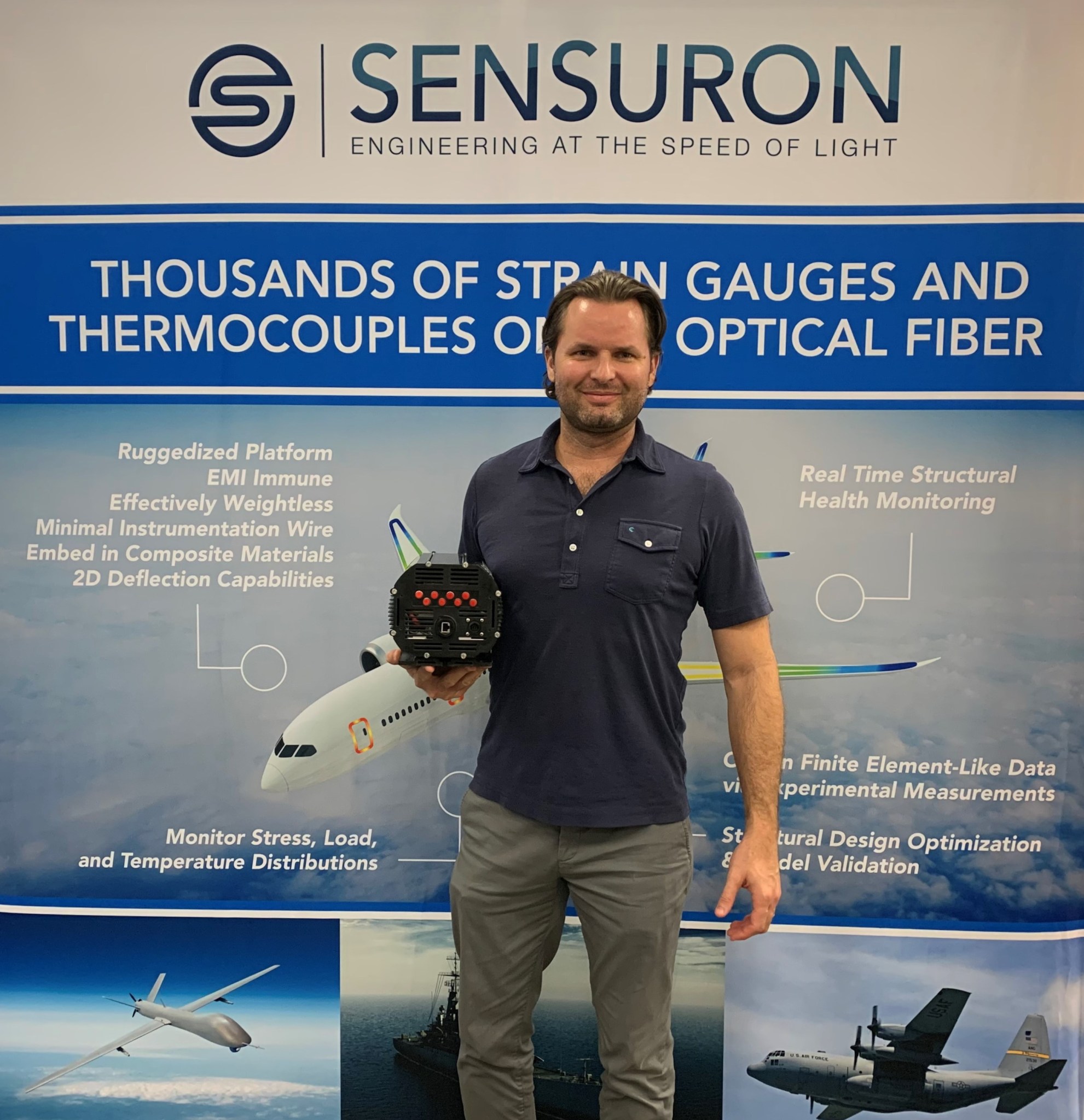 Justin Braun, chief executive officer of Sensuron, shows off one of company’s products based on FOSS technology. Sensuron was created as a result of the development work on FOSS and now sells its products worldwide. 