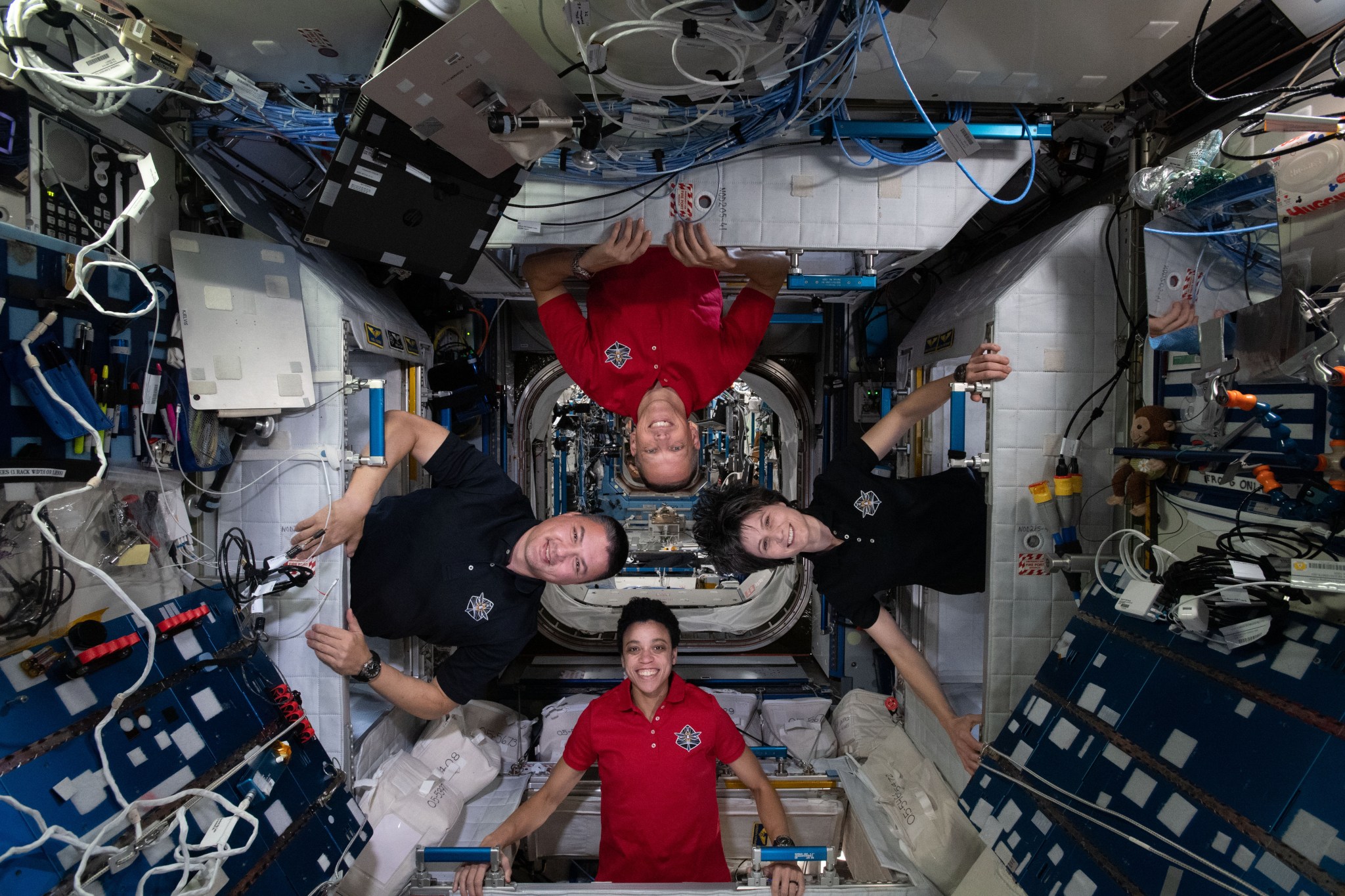 Expedition 67 Flight Engineers (clockwise from bottom) Jessica Watkins, Kjell Lindgren, and Bob Hines, all from NASA, and Samantha Cristoforetti of ESA (European Space Agency)