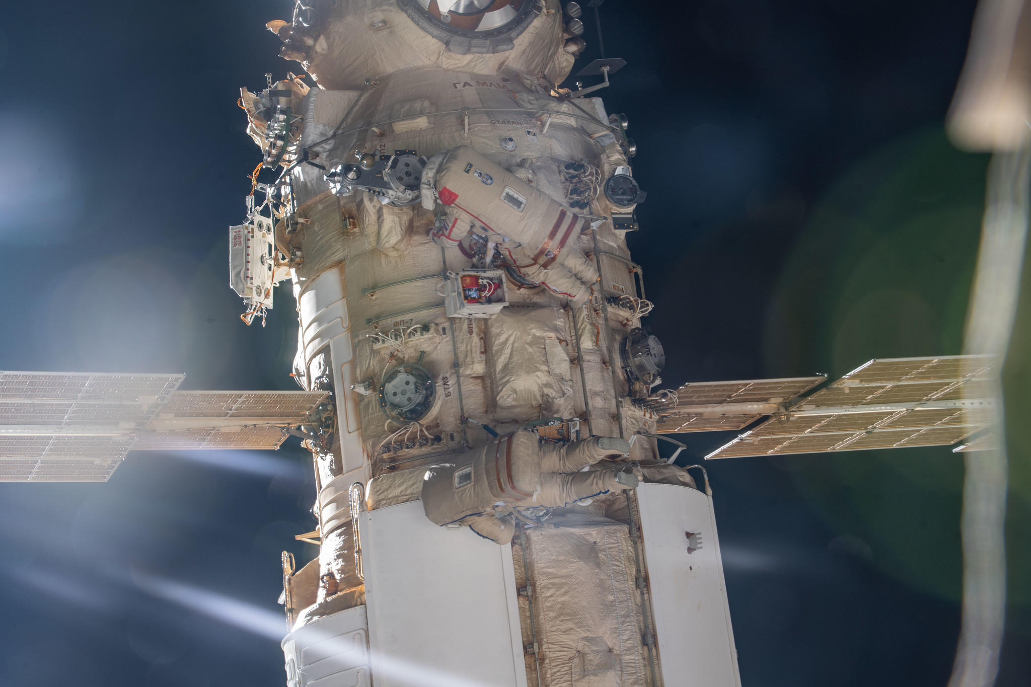Roscosmos cosmonauts Oleg Artemyev and Denis Matveev are pictured on April 28, 2022, attached to the Nauka multipurpose laboratory module during a seven-hour and 42-minute spacewalk to activate the European robotic arm on the International Space Station.