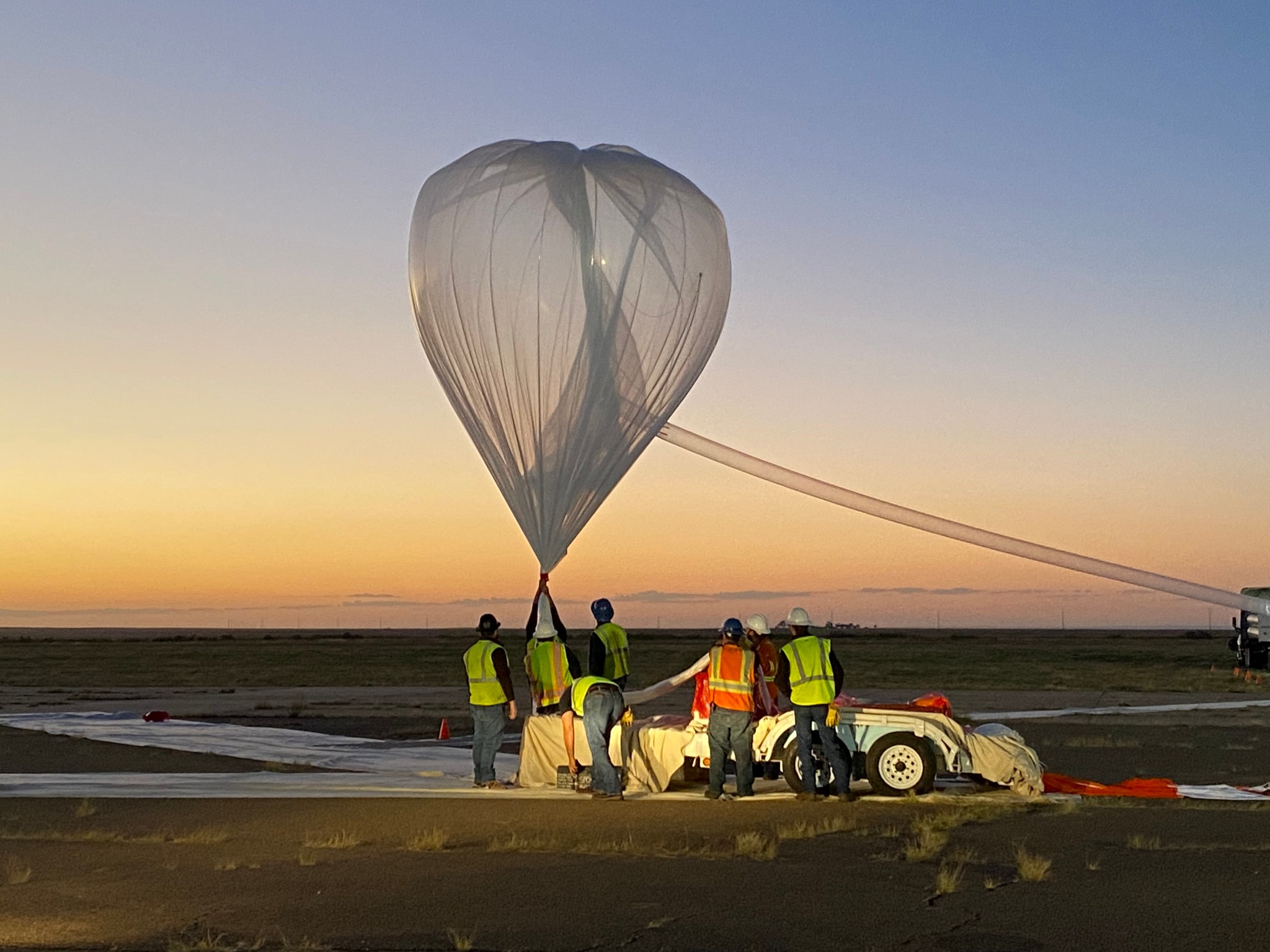 Teams prepare the hand-launch balloon for the TinMan mission from Ft. Sumner, New Mexico.