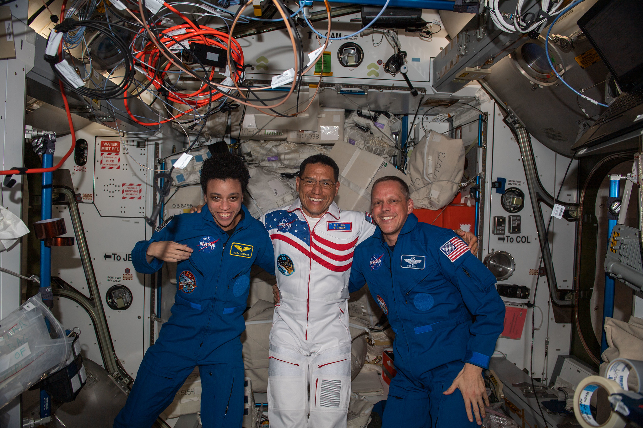 image of three NASA crewmates on the space station
