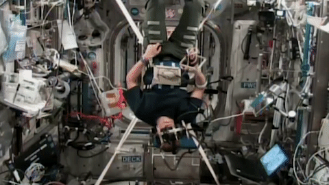 moving image of an astronaut working with an experiment