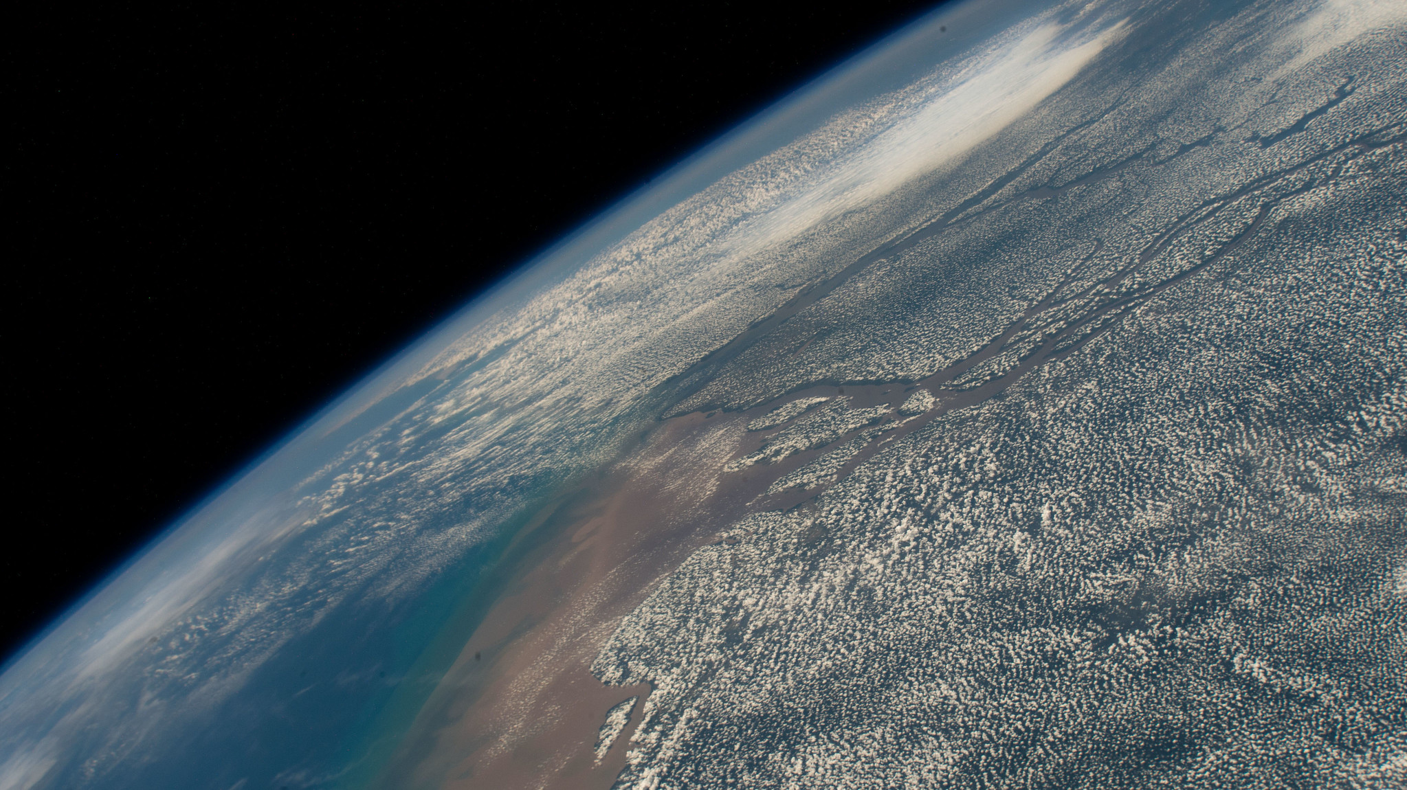 image of clouds along the Amazon River as it empties into the Atlantic Ocean 