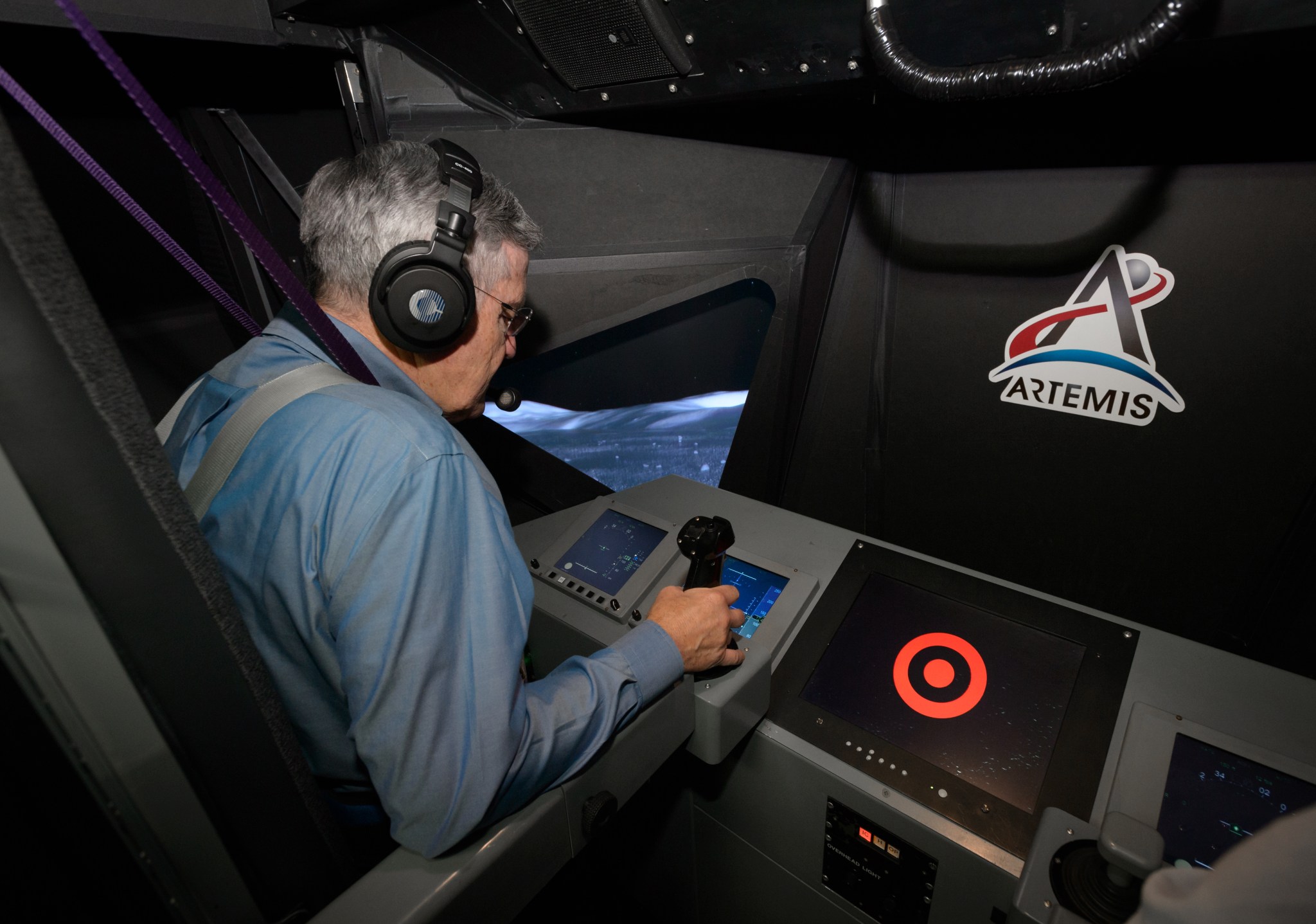 NASA Associate Administrator Robert Cabana pilots the Vertical Motion Simulator’s (VMS) N-cab lunar lander configuration.