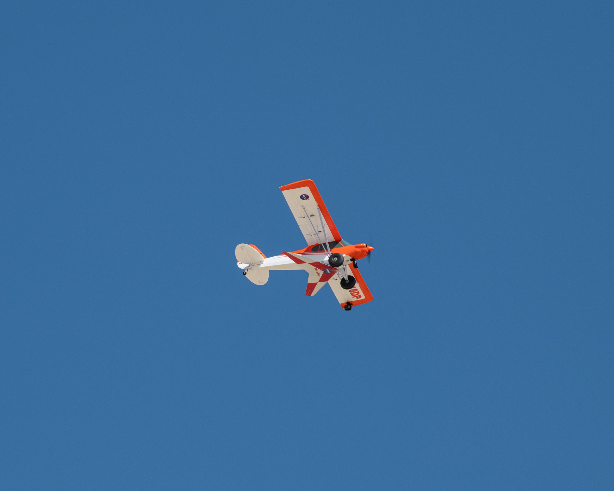 A team from NASA’s Armstrong Flight Research Center in Edwards, California, prepares a Carbon-Z Cub to air launch the Preliminary Research Aerodynamic Design to Land on Mars, or Prandtl-M, glider from a magnetic release mechanism on the cub.