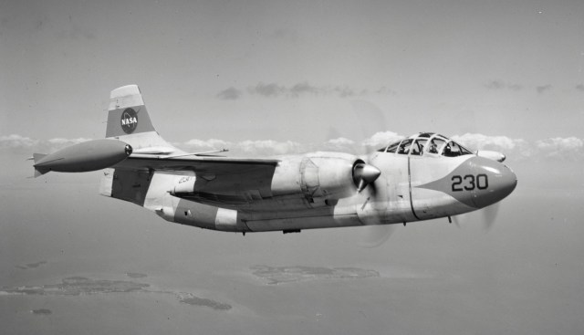 Black and white photo of NASA aircraft in flight.