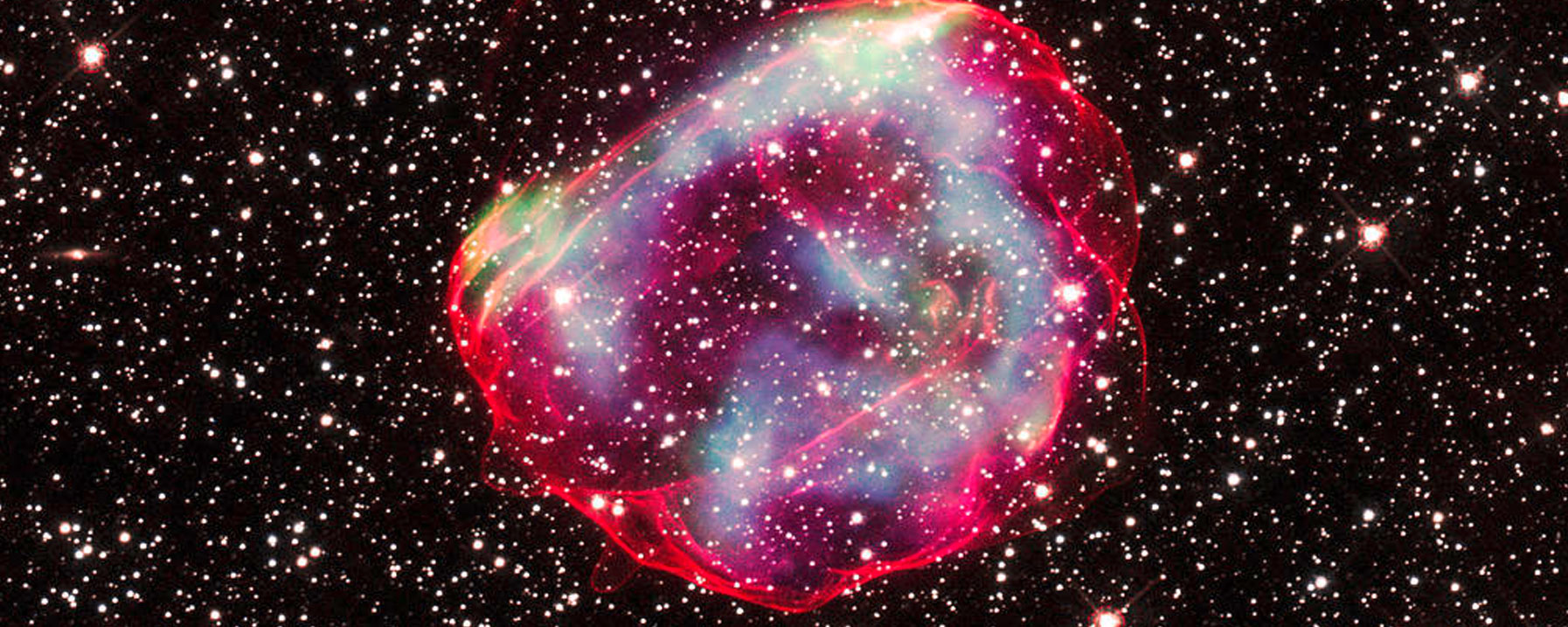 The supernova remnant called SNR 0519-69.0 (SNR 0519 for short) is the debris from an explosion of a white dwarf star. Optical data shows the perimeter of the remnant in red and stars around the remnant in white.