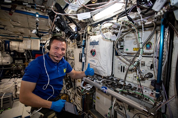 image of an astronaut working with an experiment