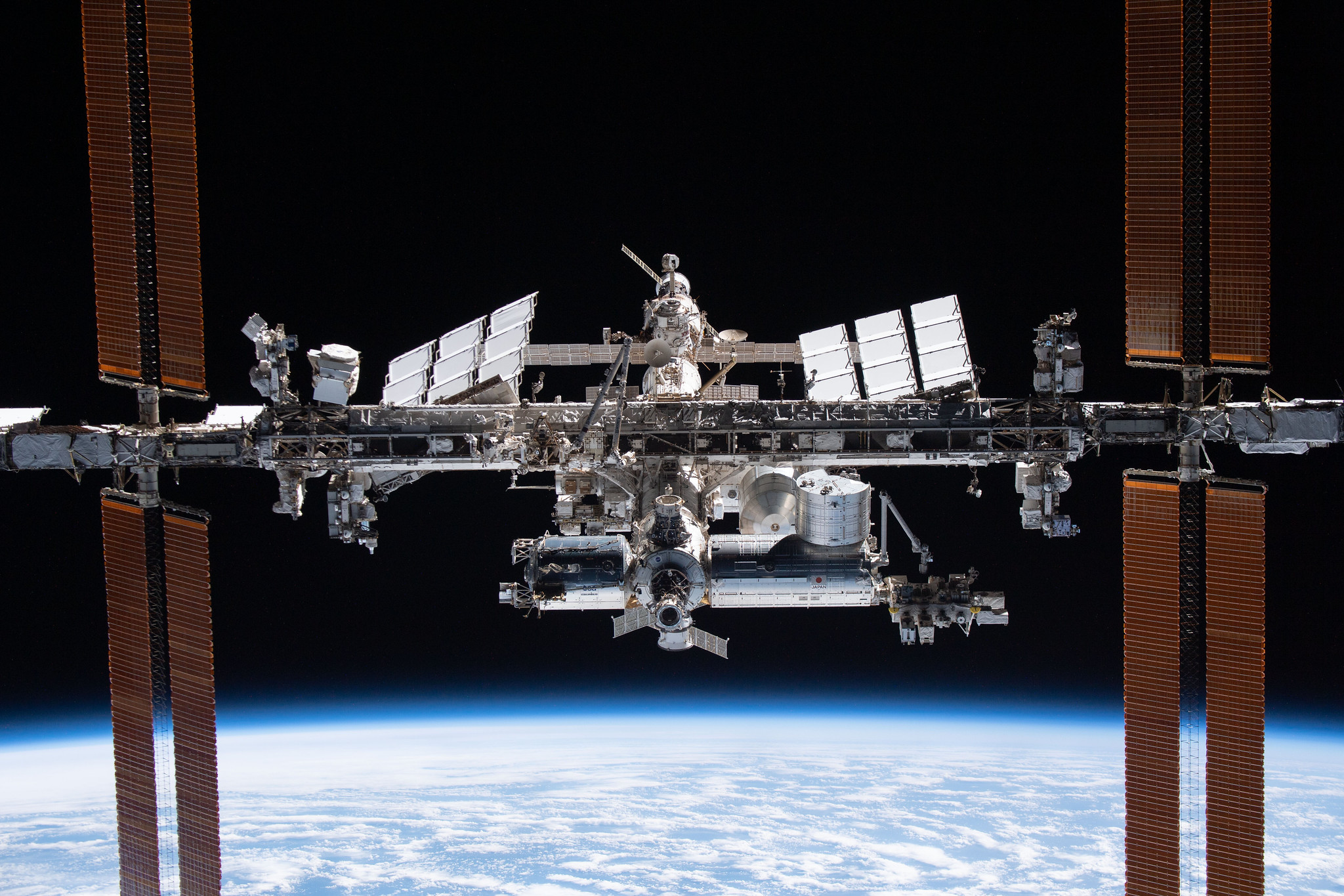 image of the space station flying over Earth