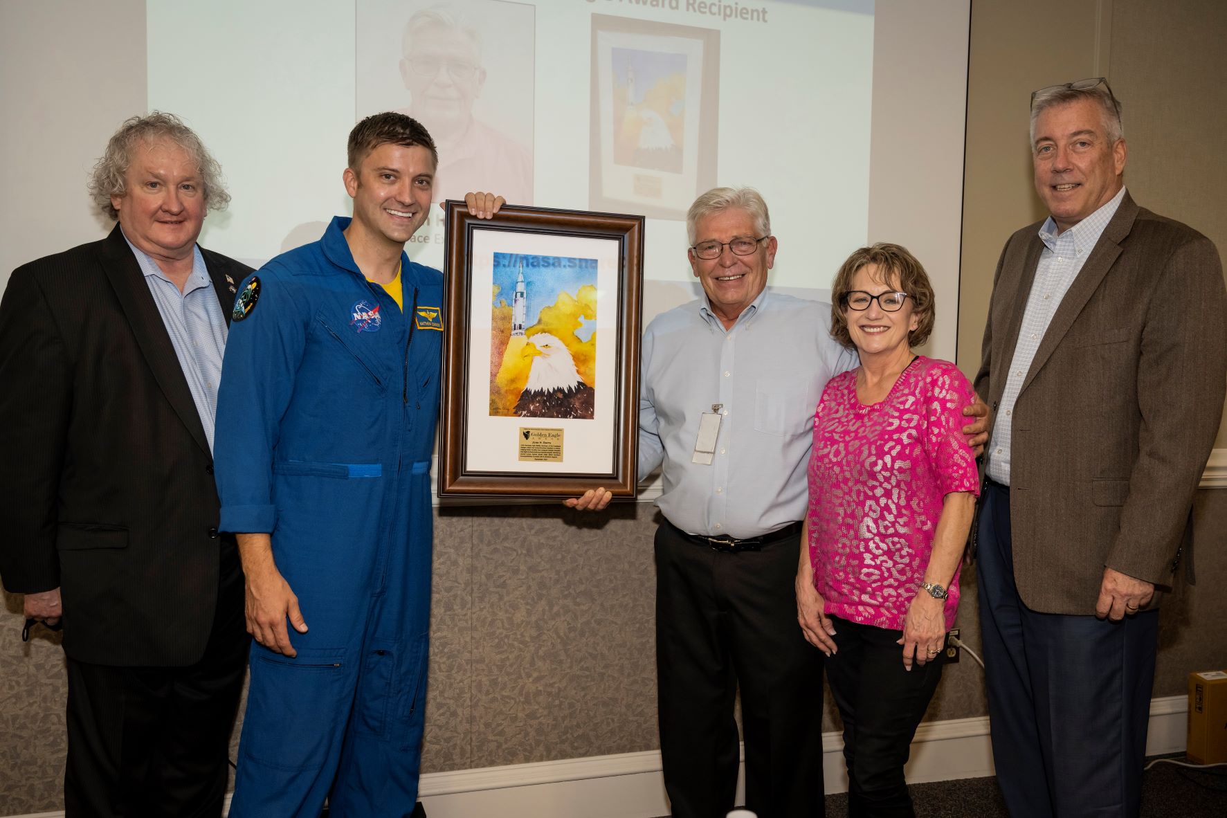 John Smith, center, receives the Golden Eagle Award during Safety Day activities Sept. 20 at NASA's Marshall Space Flight Center.