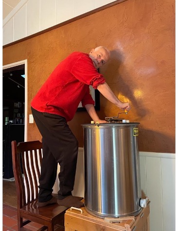 Pasquale extracting honey 