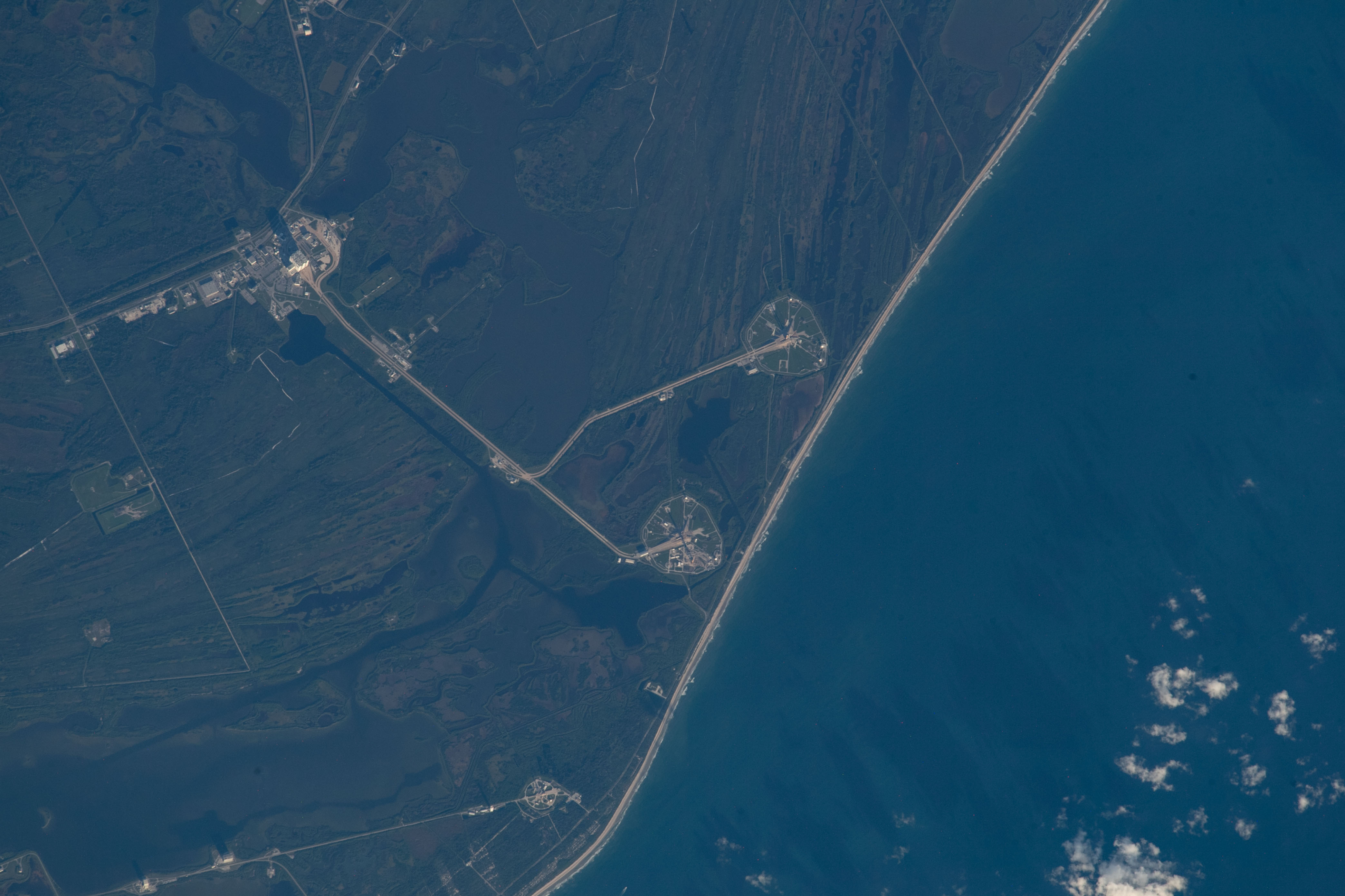 This image, taken from the space station as it orbits 259 miles above the Atlantic Ocean, shows Kennedy Space Center's launch pads, 39A and 39B, on Merritt Island in Florida. 