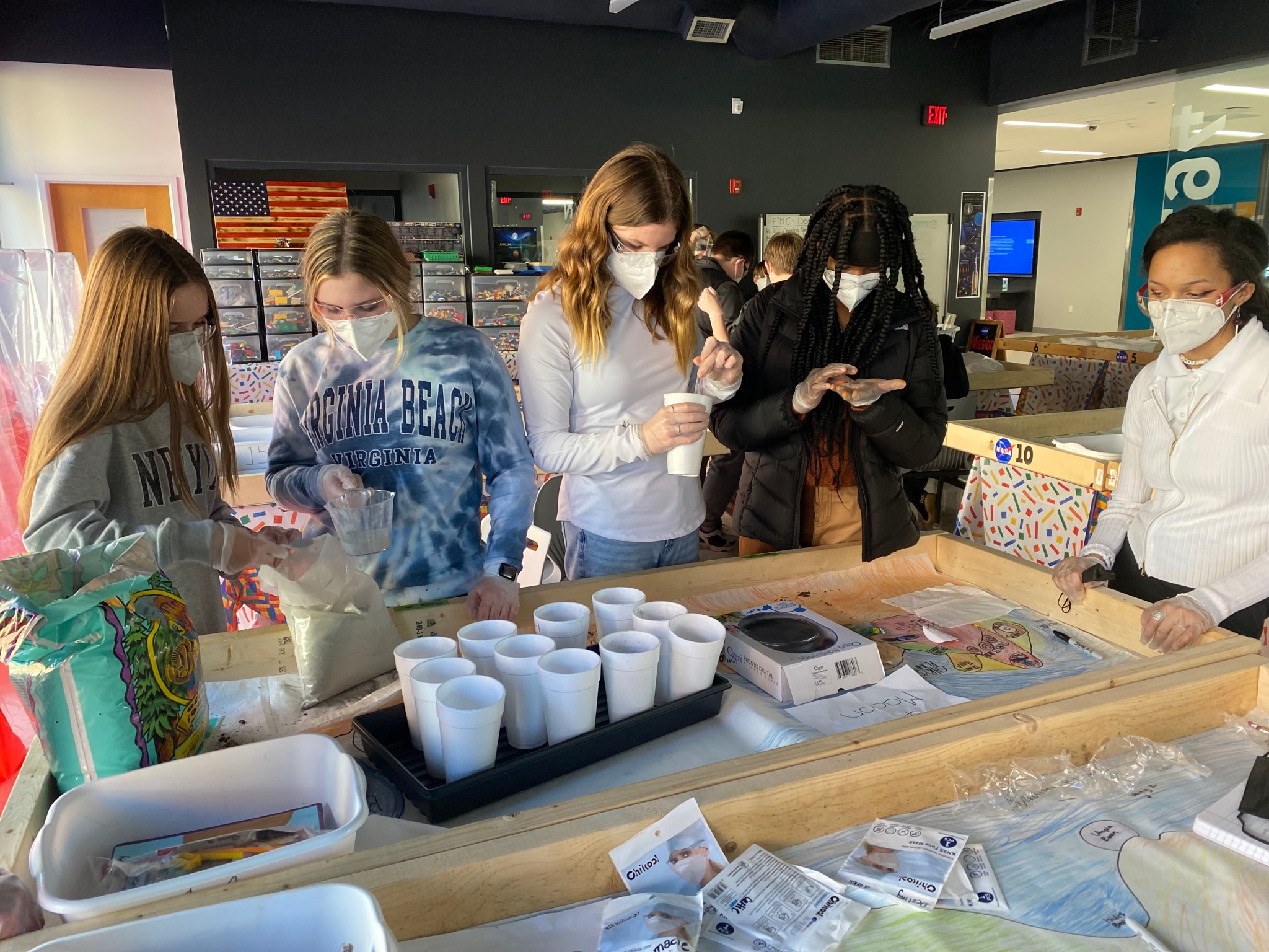 Students from Chesterfield Career and Technical Center in Chesterfield, VA calculate plant growth measurements and monitor environmental conditions for their basil plants for the Plant the Moon Challenge.n