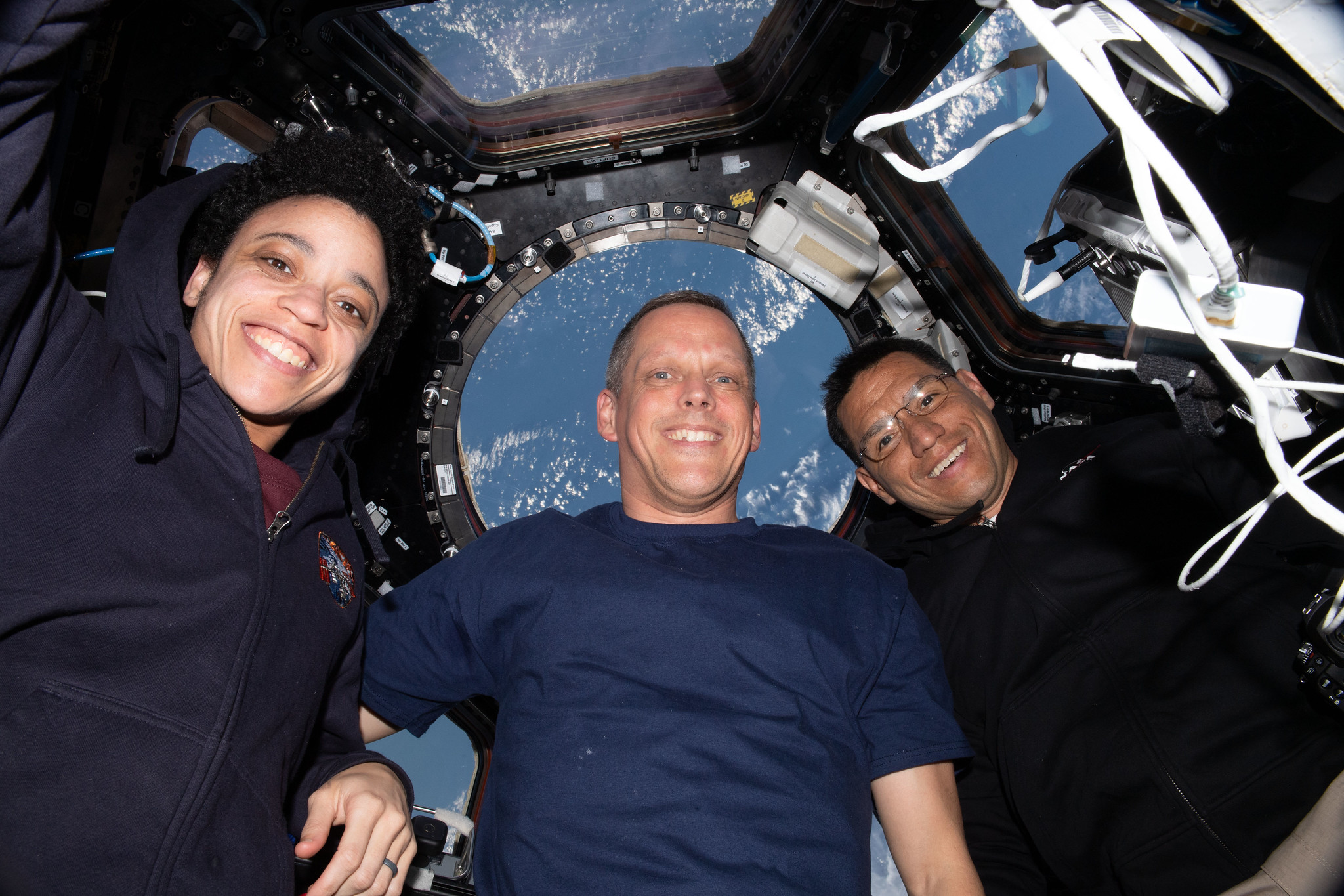 image of three astronauts inside the station's cupola