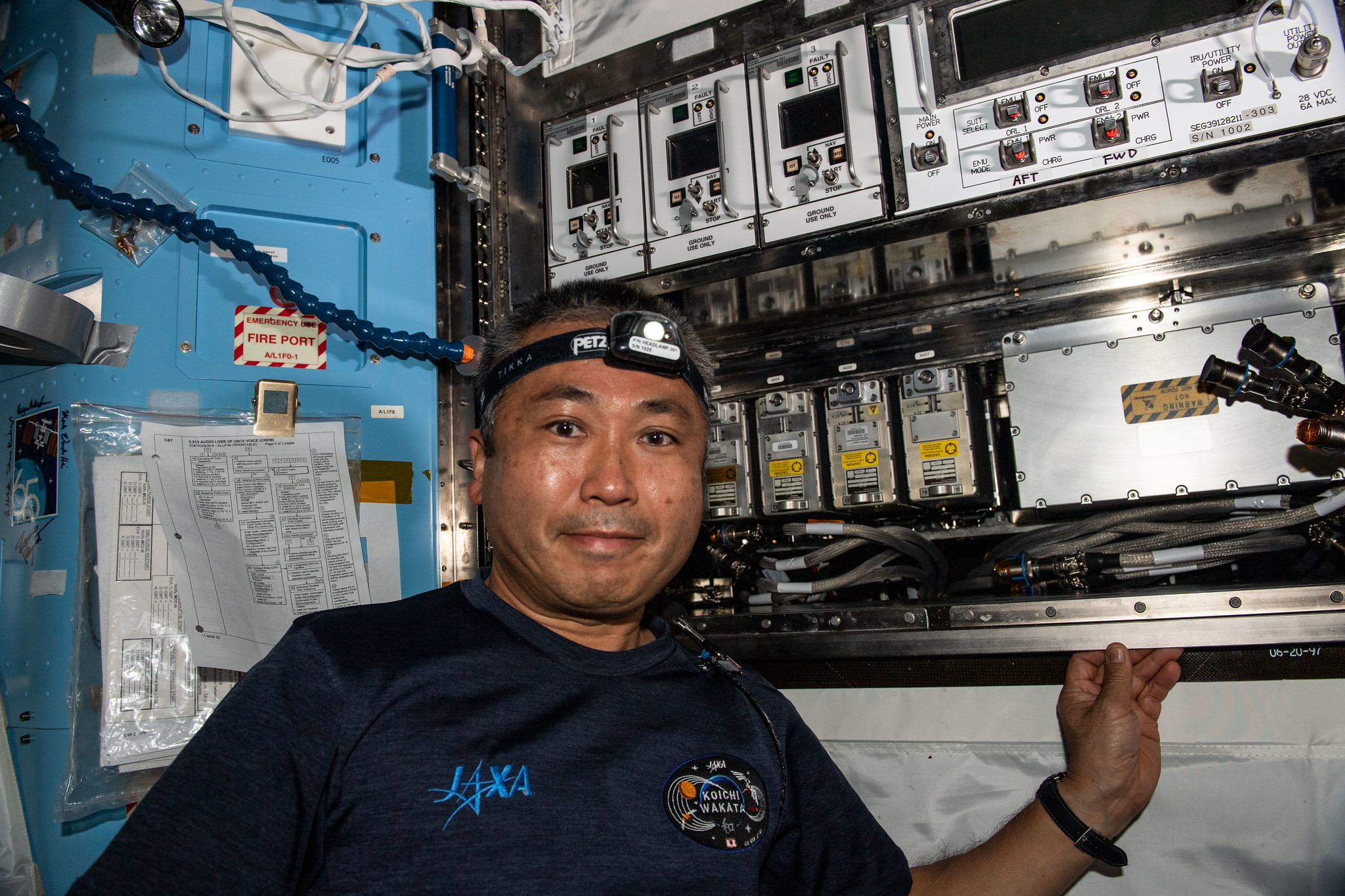 image of Koichi Wakata of the Japan Aerospace Exploration Agency (JAXA) works in the U.S. Quest airlock on electronics components. 