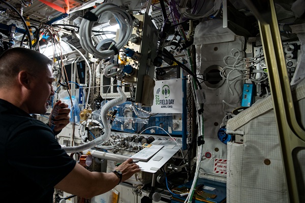 image of an astronaut using the Ham radio