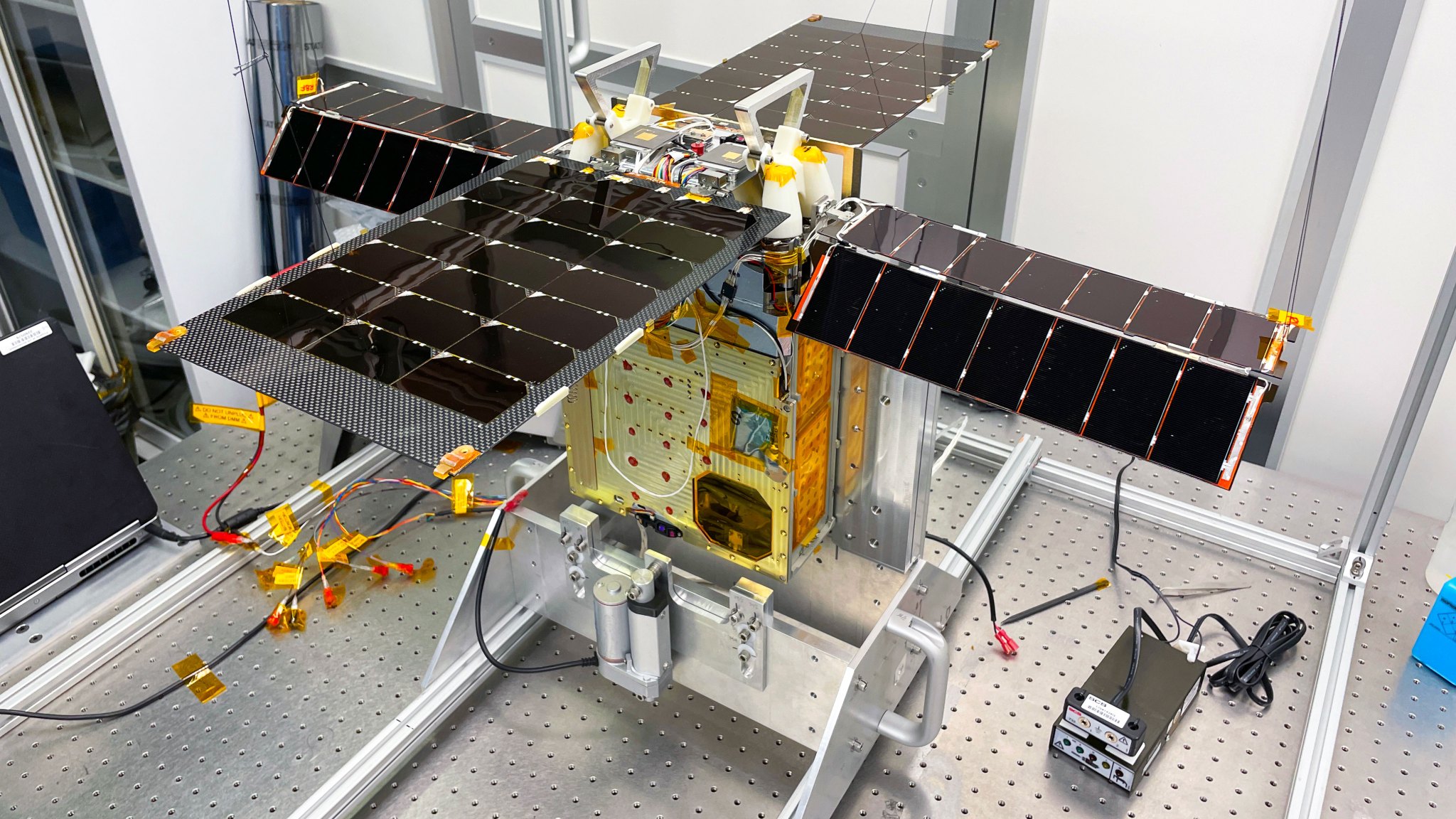 Earlier this year, NASA’s Lunar Flashlight mission underwent tests to prepare it for launch in November 2022. The solar-powered small satellite is shown here with its for solar arrays extended in a Georgia Tech clean room.