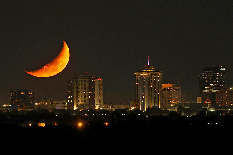 A crescent moon sets over the Crescent City in a photo shot from near NASA's Michoud Assembly Facility in New Orleans on Sept. 30.