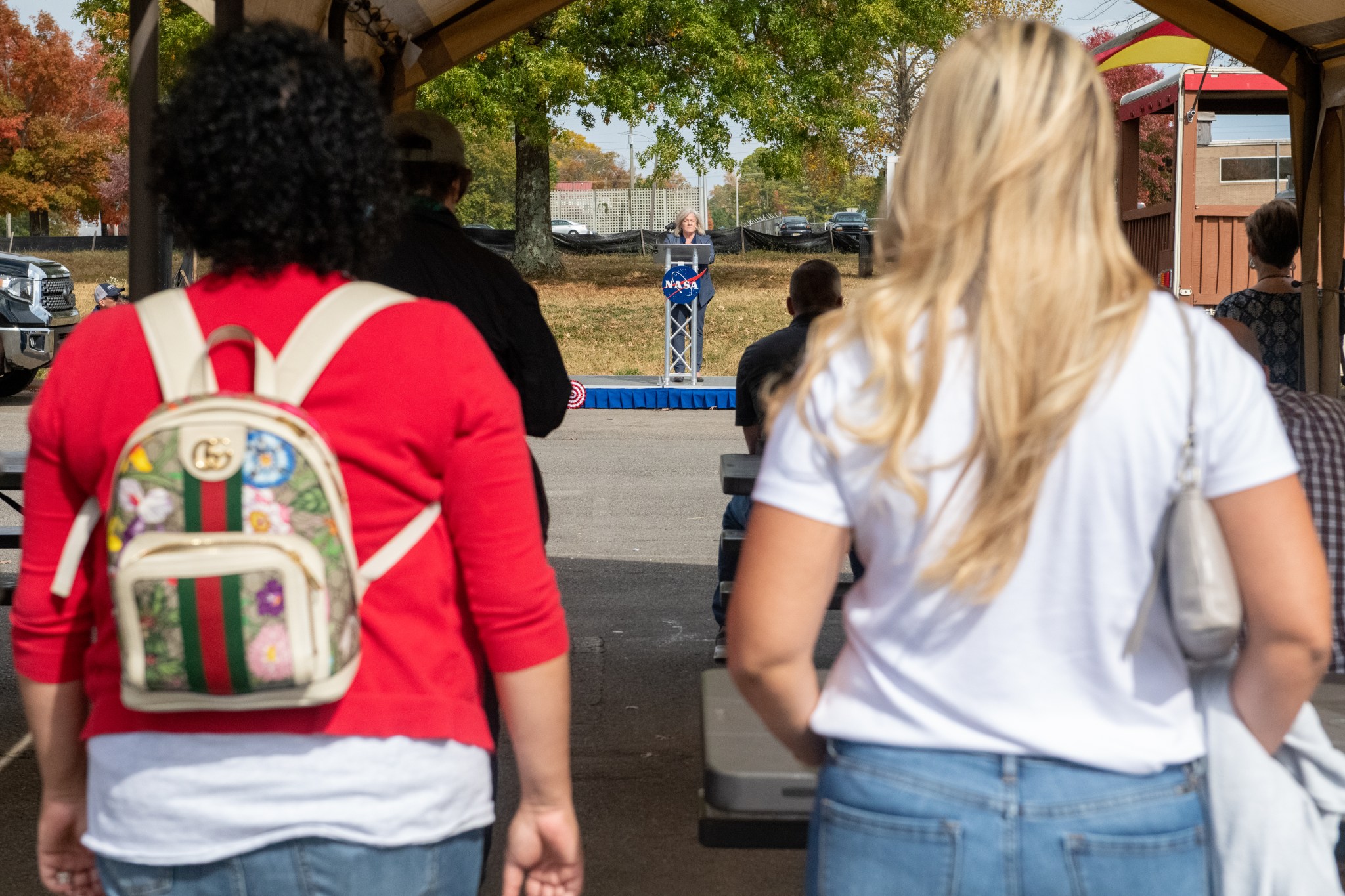 Attendees at the Food Truck Corral at Redstone Arsenal listen as Marshall Space Flight Center Director Jody Singer speaks during Marshall’s Combined Federal Campaign (CFC) kickoff and charity fair Oct. 25. 