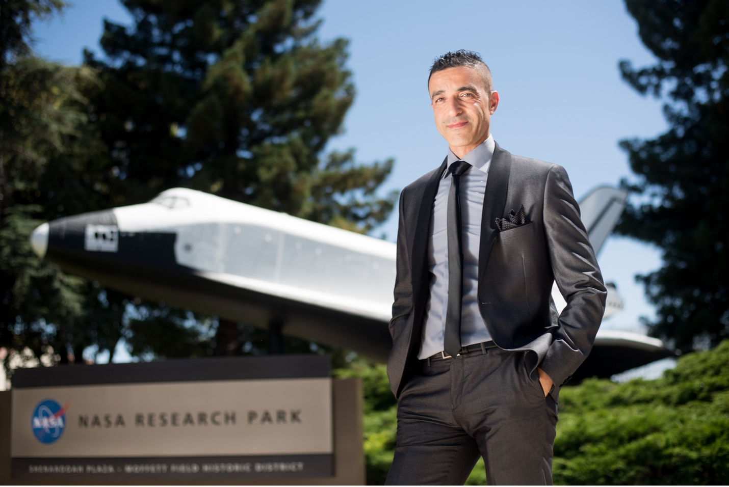 Fathi Karouria in front of Shuttle at NASA Ames Research Park