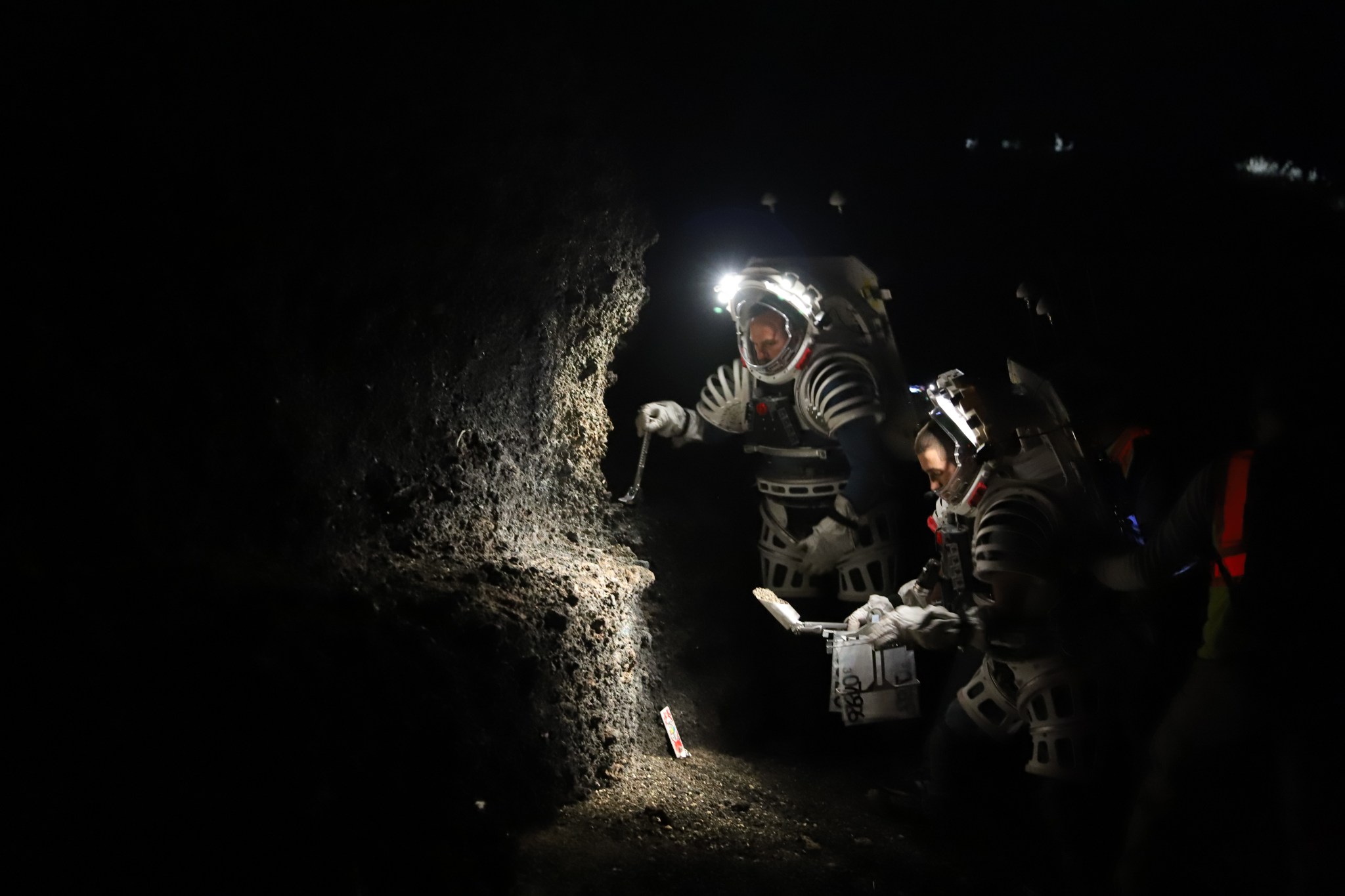 NASA Test Engineers wear Atlas mockup spacesuits while practicing sample collection and moonwalking operations during Joint Extravehicular Activity Test Team Field Test #1 (JETT1) in New Mexico to prepare for lunar surface missions.