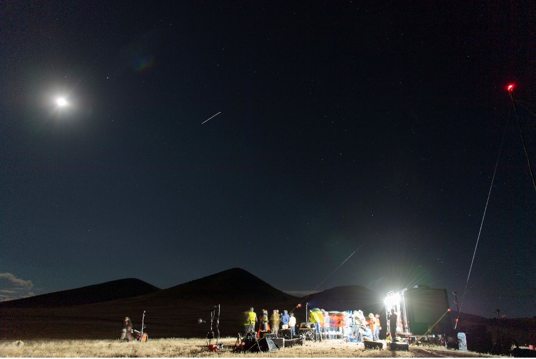 Photo of Space Station, flying over while teams were setting up for the moonwalk. The streak in the photograph is from the camera’s shutter remaining open to capture the Station flying by.