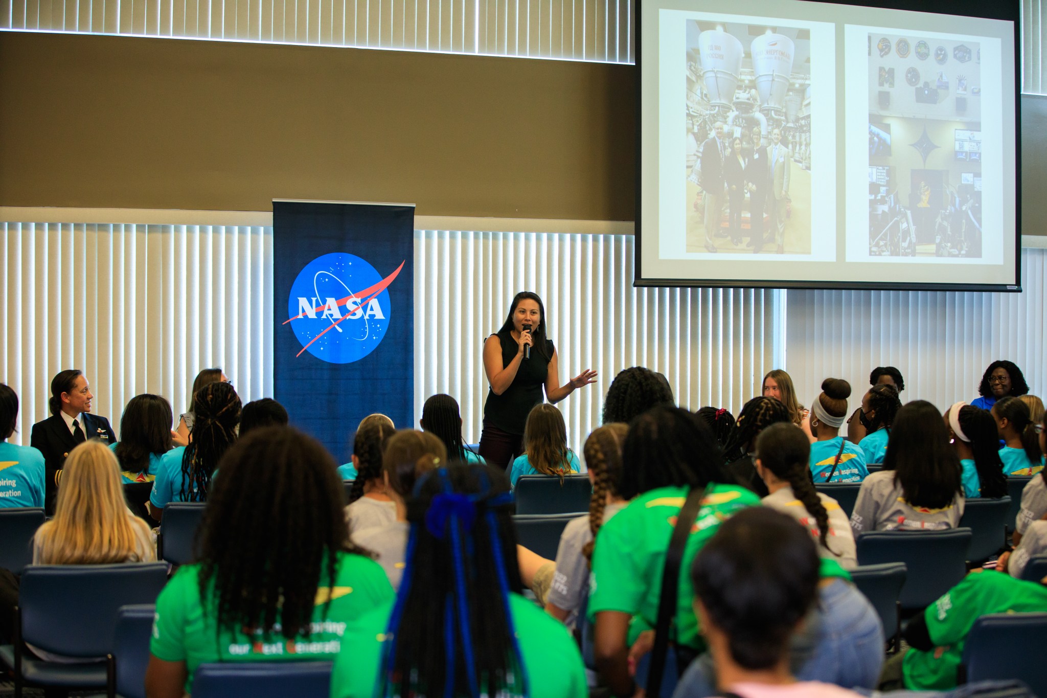 Josephine Pereira, Kennedy Space Center’s chief of Workforce Strategy and Development, speaks to students who were brought to Kennedy on Delta Air Lines’ Women Inspiring Our Next Generation (WING) flight.