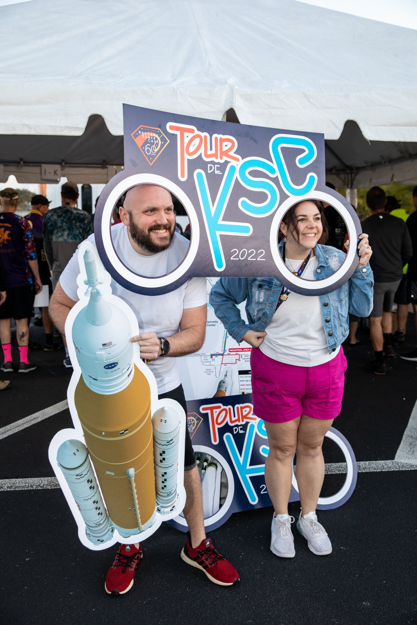 Participants in the Diamond Tour de KSC pause for a selfie at NASA’s Kennedy Space Center Visitor Complex before beginning their bicycle routes at Kennedy Space Center in Florida on Oct. 22, 2022.