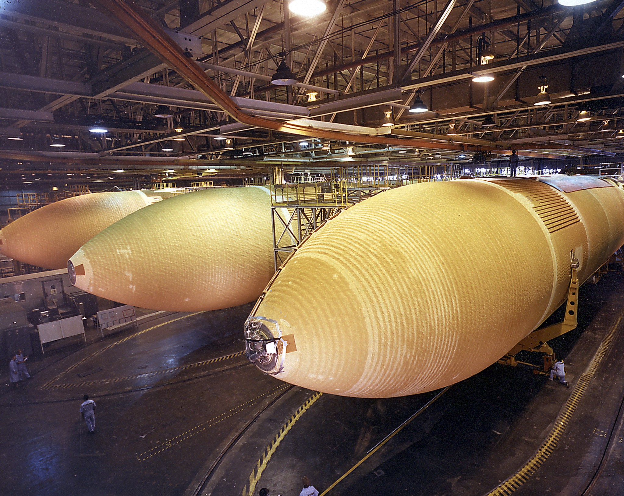 Three External Tanks from the Space Shuttle programs at the Michoud Assembly Facility. The giant cylinder, higher than a 15-story building, with a length of 154-feet (47-meters) and a diameter of 27.5-feet (8.4-meters), is the largest single piece of the Space Shuttle. 