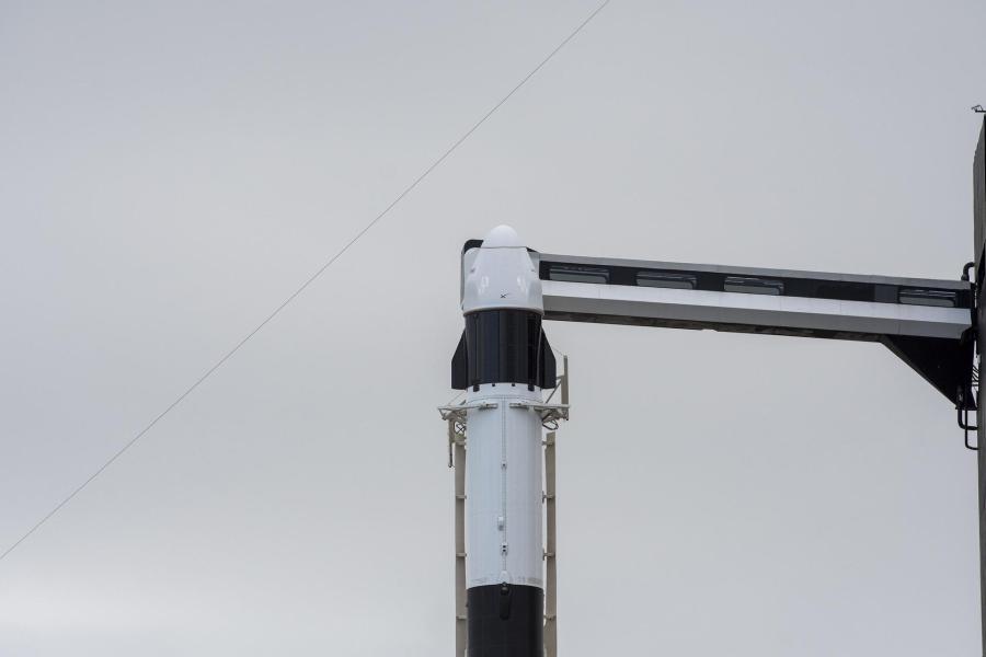 Seen here is the SpaceX Dragon cargo spacecraft atop the company’s Falcon 9 rocket after being raised to a vertical position at NASA’s Kennedy Space Center in Florida on Nov. 21, 2022, in preparation for the 26th commercial resupply services launch to the International Space Station. The mission will deliver new science investigations, supplies, and equipment to the crew aboard the space station, including the next pair of ISS Roll Out Solar Arrays (iROSAs).