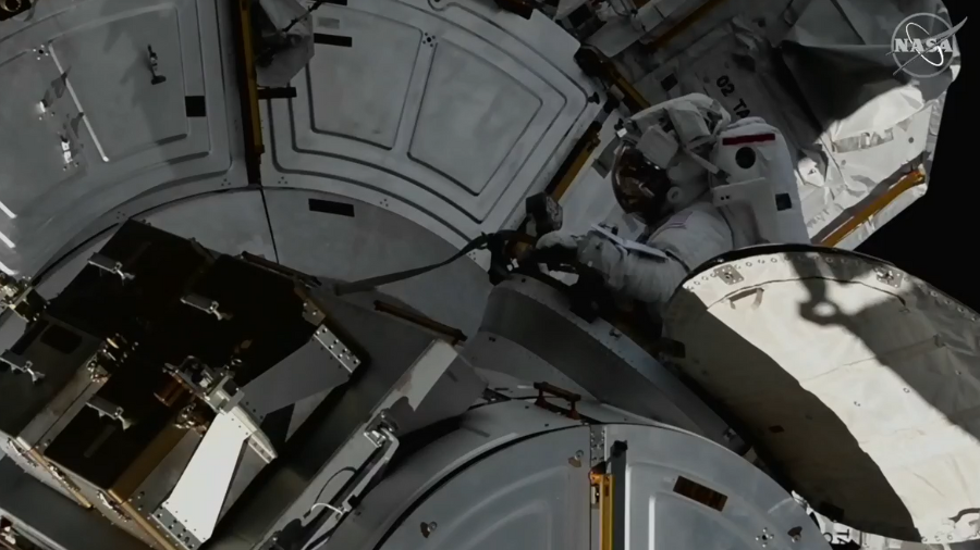 NASA Astronaut Josh Cassada enters the airlock at the end of Tuesday’s spacewalk to prepare the station for upcoming solar array upgrades.