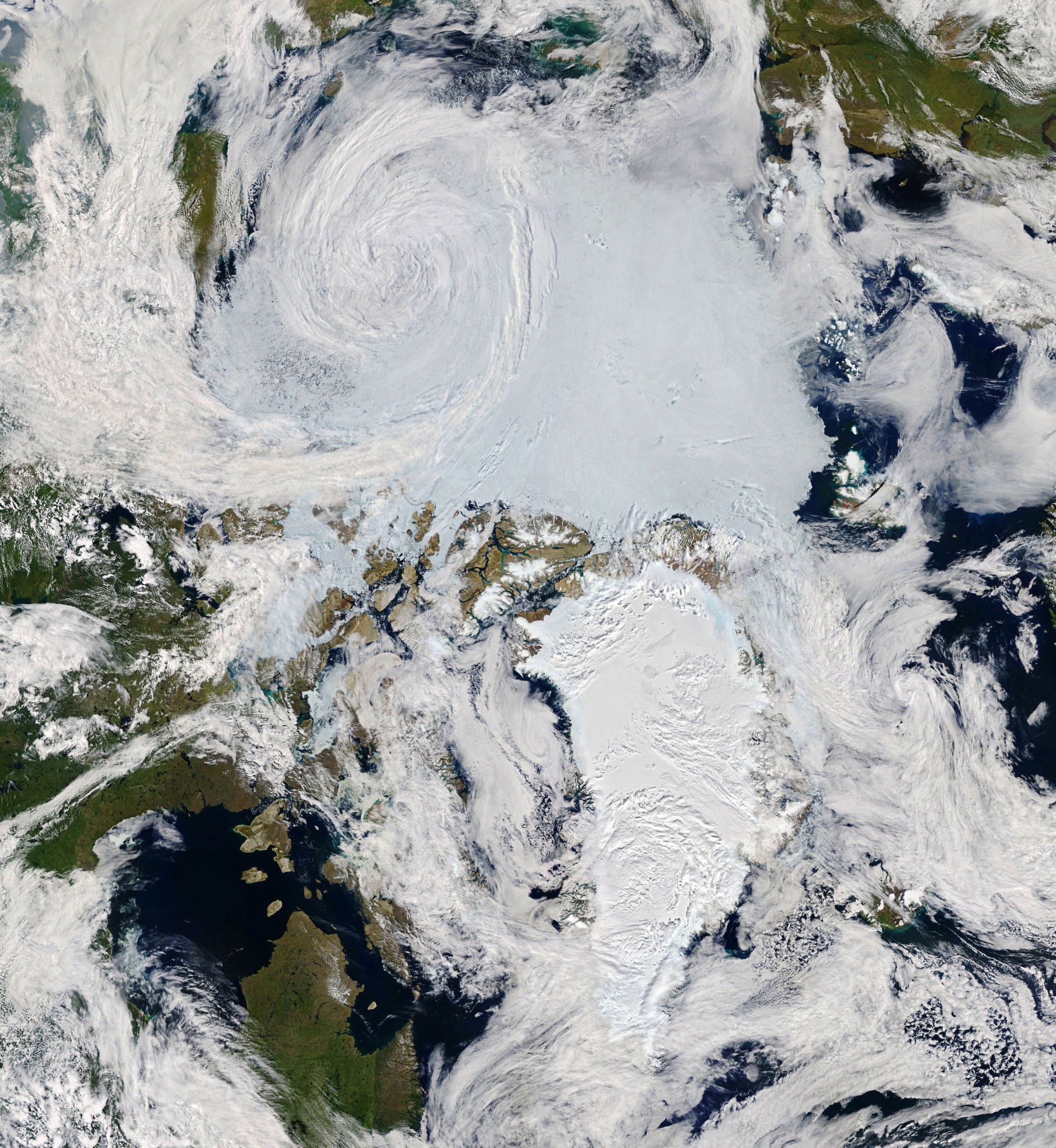 An image of an Arctic cyclone swirling over the Arctic Ocean on July 28, 2020, captured by the Moderate Resolution Imaging Spectroradiometer (MODIS) on NASA’s Terra and Aqua satellites.