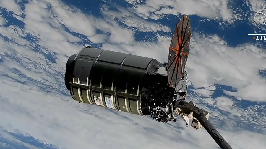 The Cygnus cargo craft is pictured moments after being captured with the Canadarm2 robotic arm controlled by NASA astronaut Nicole Mann. Credit: NASA TV